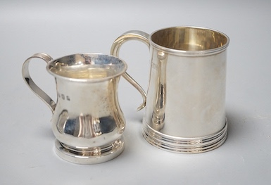 A George V silver christening mug, Goldsmiths & Silversmiths Co. Ltd, London, 1915, 85mm and a smaller Scottish silver christening mug, 9oz.